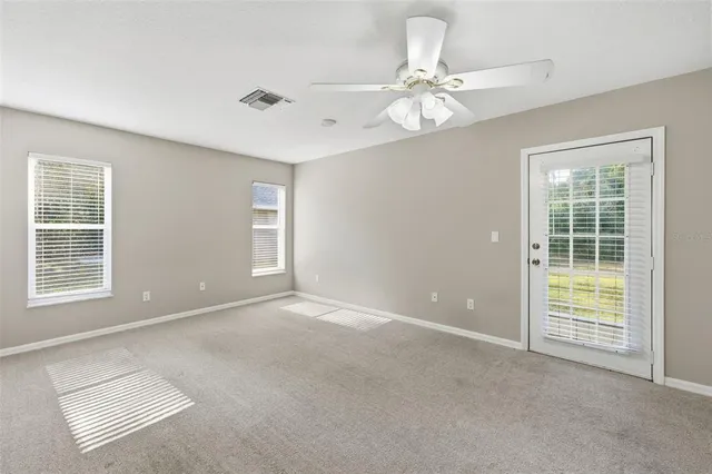 a spacious bathroom with a granite countertop sink a mirror and a