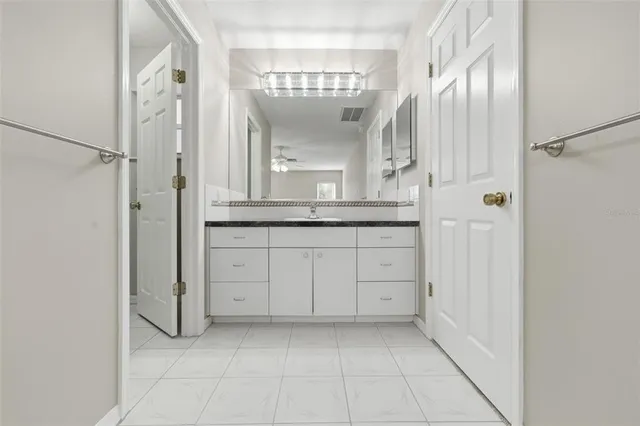 a view of a hallway with a wooden door