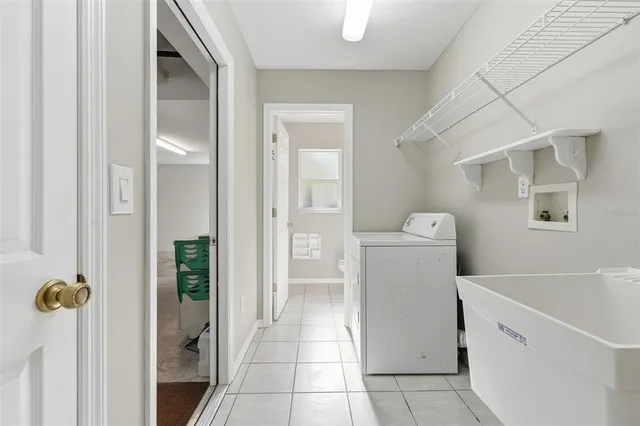 a view of an empty room with a floor to ceiling window