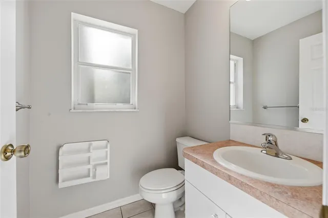 a view of a two room with a floor to ceiling window next to a yard