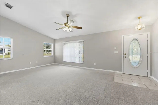 a kitchen with kitchen island white cabinets and stainless steel appliances