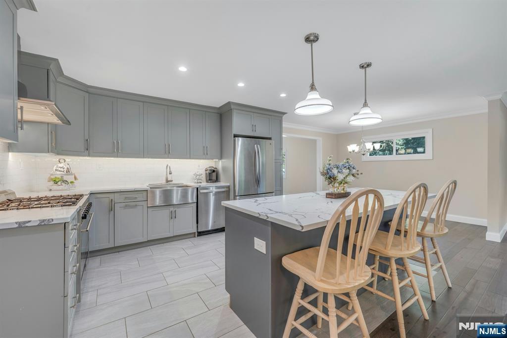 82 Little Falls Road Cedar Grove, NJ 07009 - Photo 12 of 36 a kitchen with cabinets and counter space