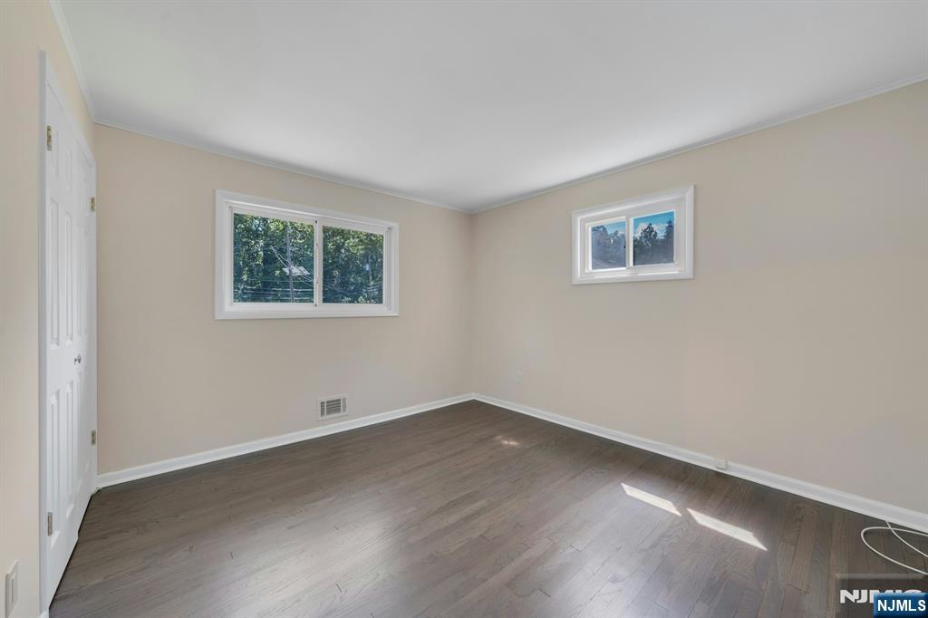 82 Little Falls Road Cedar Grove, NJ 07009 - Photo 18 of 36 an empty room with a window