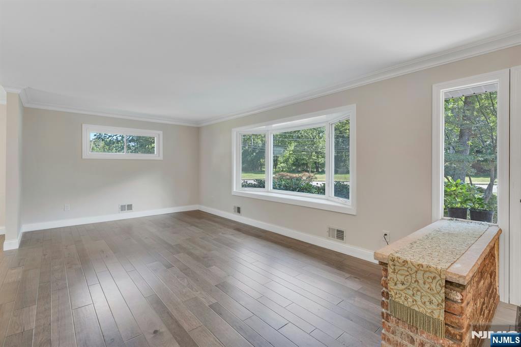 82 Little Falls Road Cedar Grove, NJ 07009 - Photo 19 of 36 a view of an empty room with wooden floor and a window