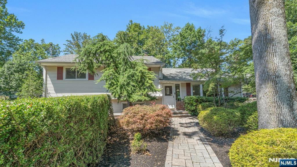 82 Little Falls Road Cedar Grove, NJ 07009 - Photo 2 of 36 a front view of a house with garden
