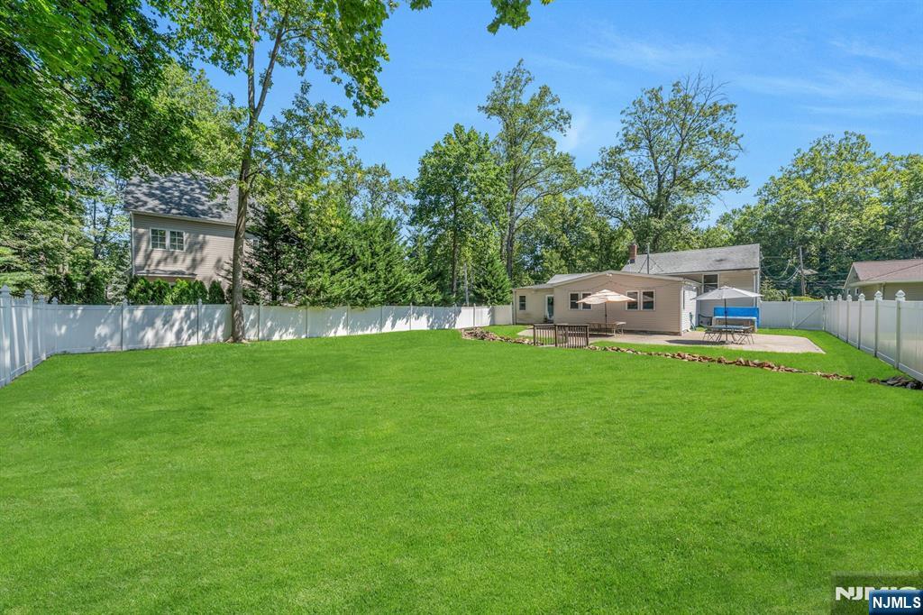 82 Little Falls Road Cedar Grove, NJ 07009 - Photo 28 of 36 a view of house with backyard