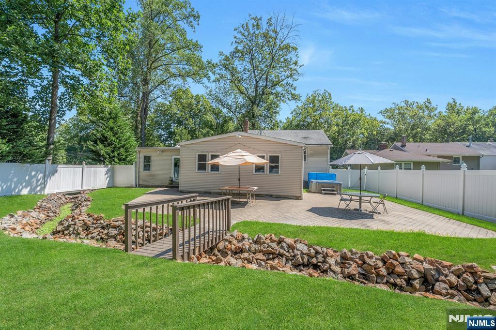 82 Little Falls Road Cedar Grove, NJ 07009 - Photo 29 of 36 a view of a house with backyard and sitting area
