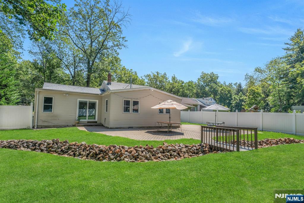 82 Little Falls Road Cedar Grove, NJ 07009 - Photo 30 of 36 a house that is sitting in the grass