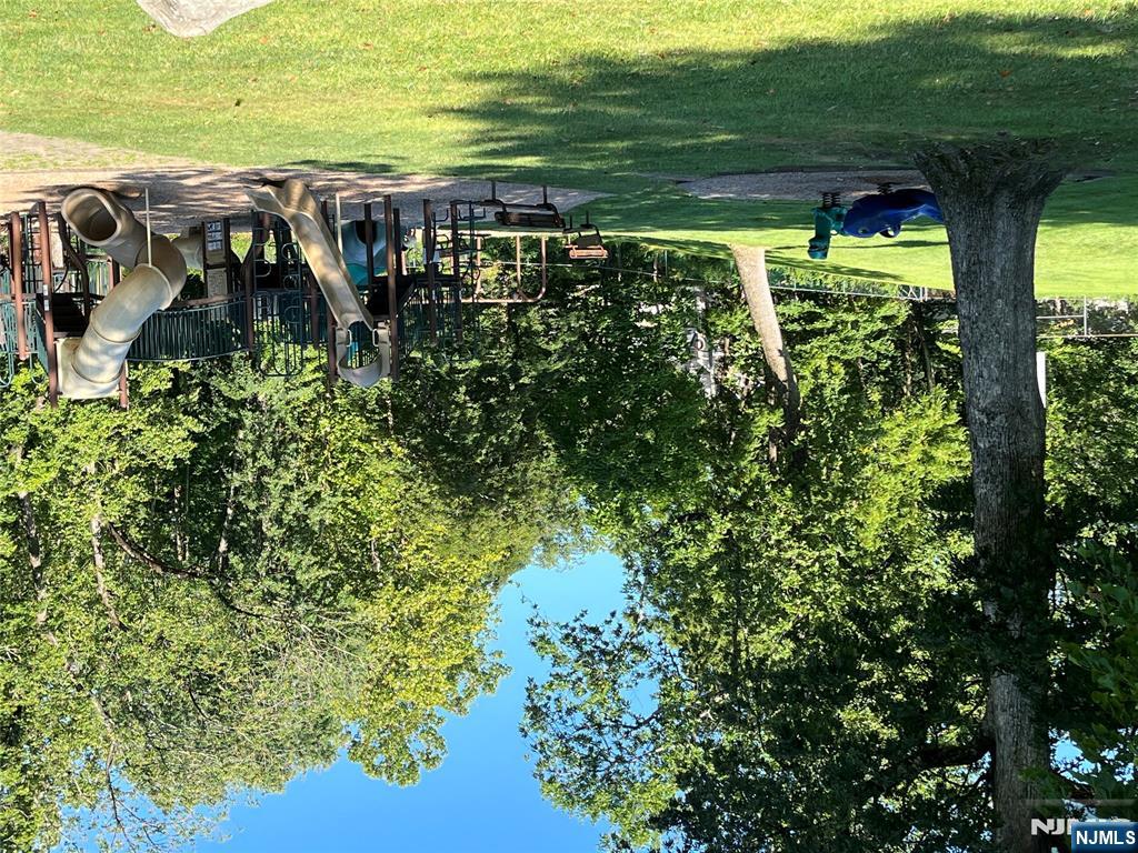 82 Little Falls Road Cedar Grove, NJ 07009 - Photo 36 of 36 a view of a swimming pool with a bench