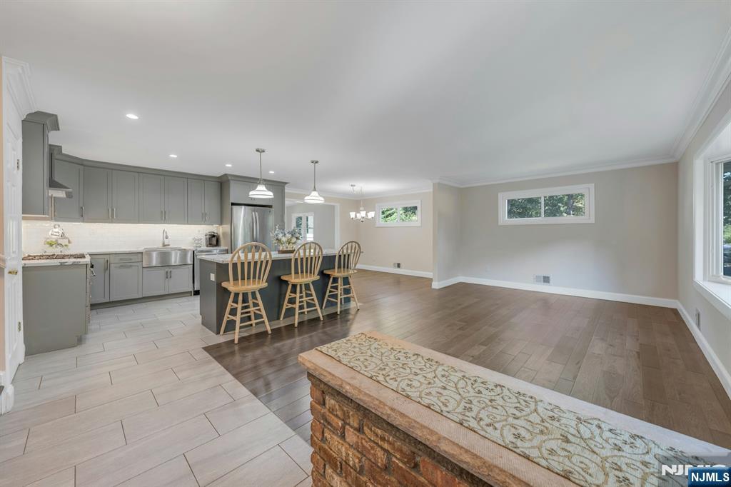 82 Little Falls Road Cedar Grove, NJ 07009 - Photo 7 of 36 a living room with stainless steel appliances kitchen island granite countertop furniture and a view of kitchen