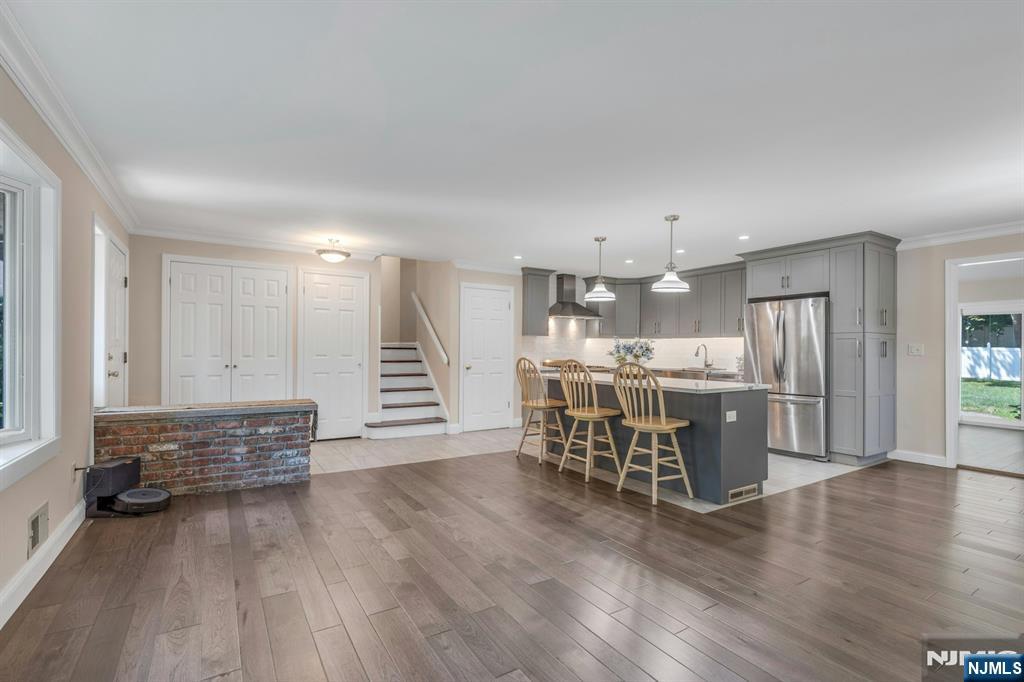 82 Little Falls Road Cedar Grove, NJ 07009 - Photo 10 of 36 a open kitchen with white cabinets and wooden floor