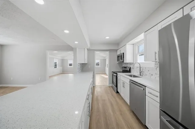 a large kitchen with a lot of counter space