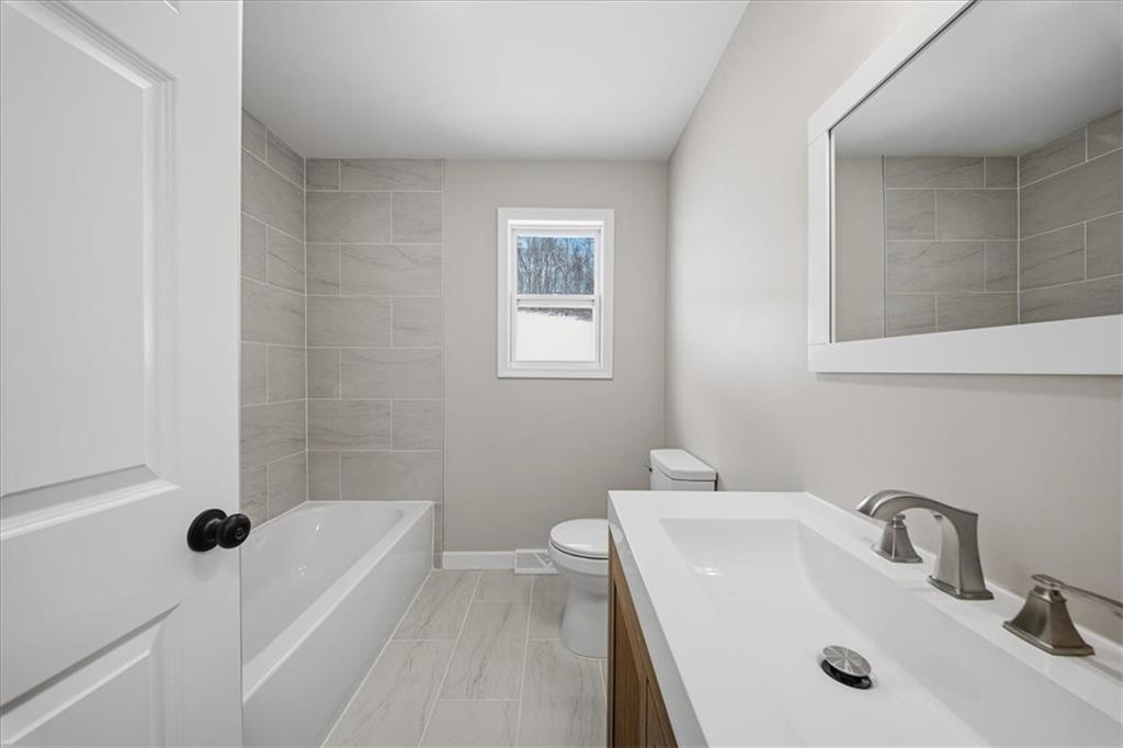 214 McCleary Road Aliquippa, PA 15001 - Photo 16 of 29 a bathroom with a sink a toilet and shower