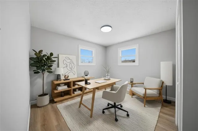 a view of a workspace with furniture and a couch