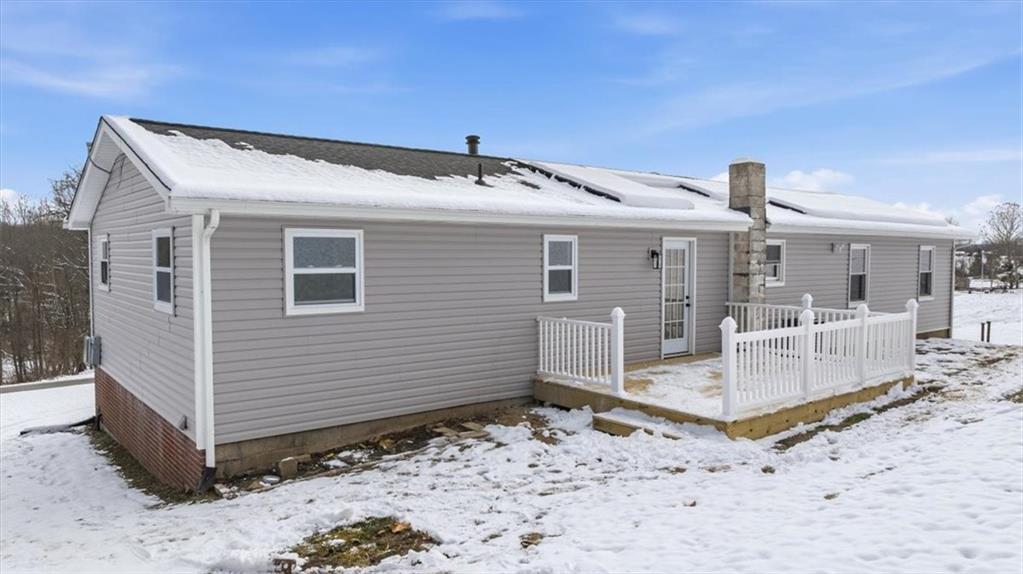 214 McCleary Road Aliquippa, PA 15001 - Photo 22 of 29 a view of a house with a snow in the yard
