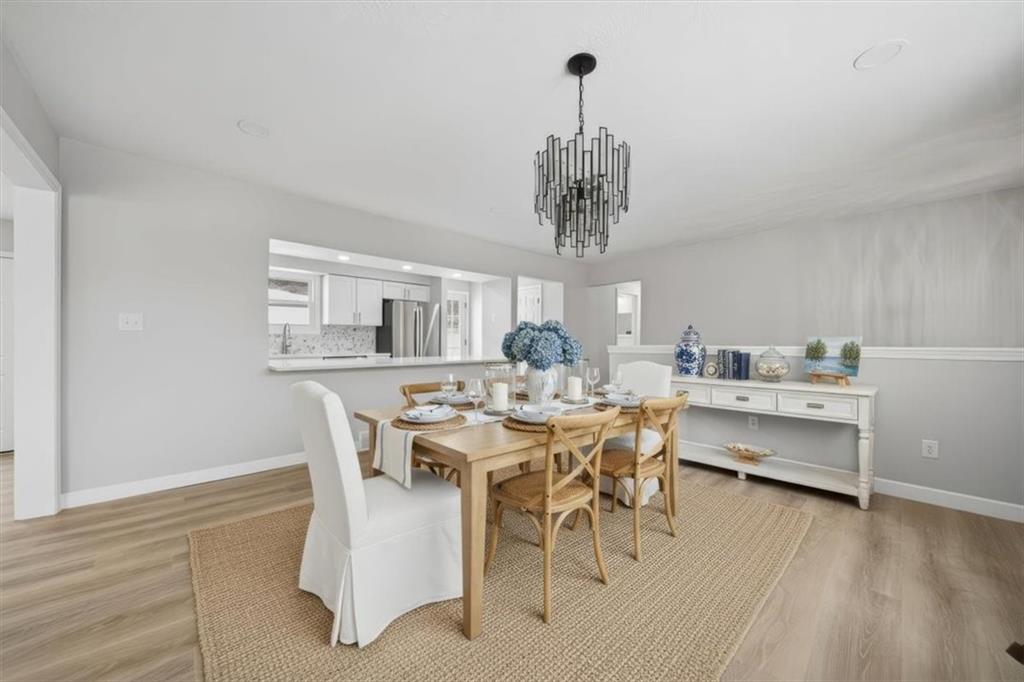 214 McCleary Road Aliquippa, PA 15001 - Photo 3 of 29 a view of a dining room with furniture window and wooden floor