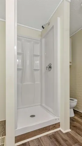 a bathroom with a glass shower door
