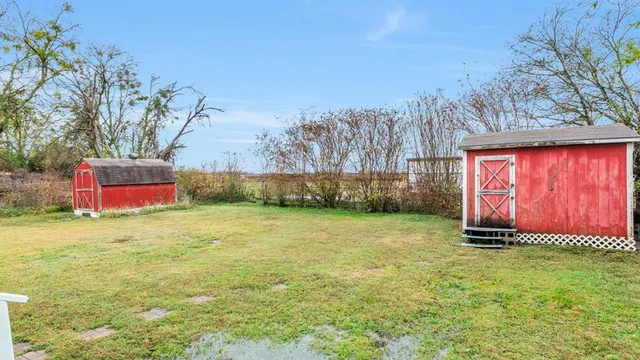 a backyard of a house with lots of green space