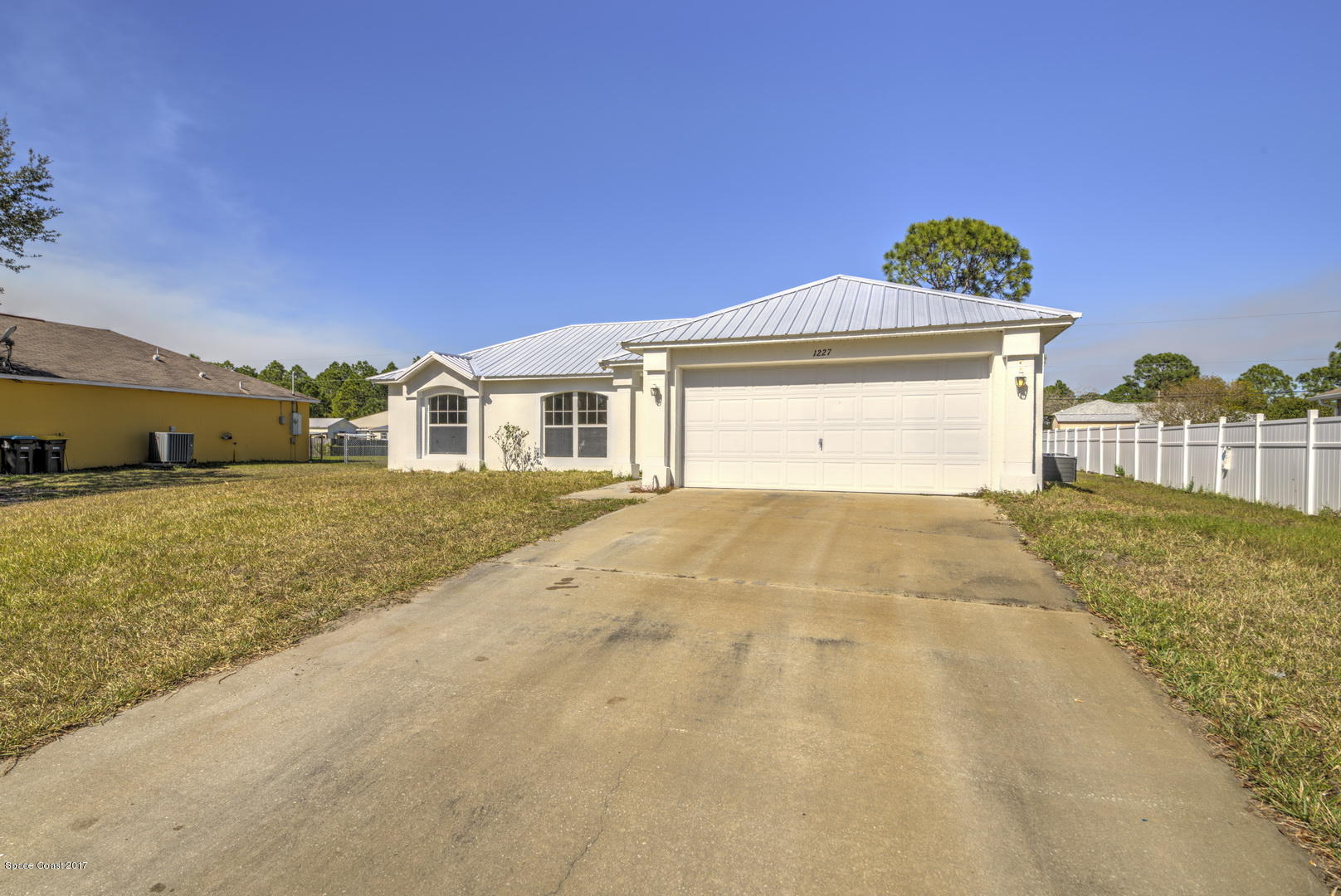 1227 Danforth Street Southwest Palm Bay, FL 32908 - Photo 3 of 42 Two Car Garage