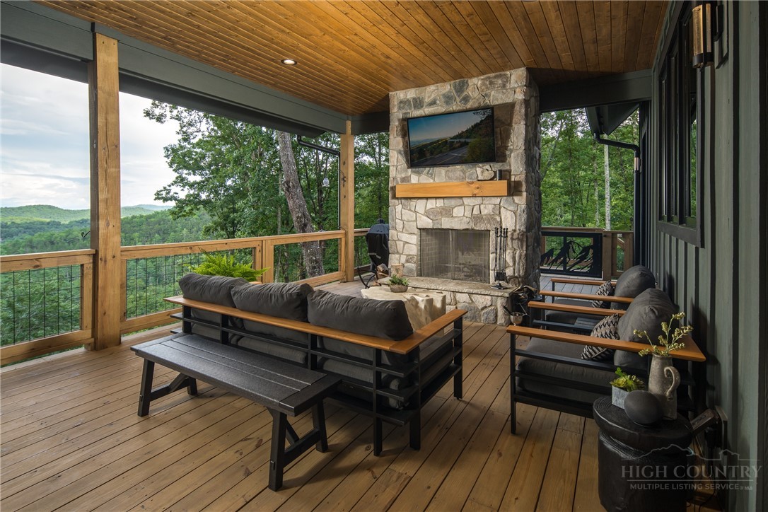 1236 Ninebark Road Boone, NC 28607 - Photo 12 of 50 a balcony with furniture and wooden floor