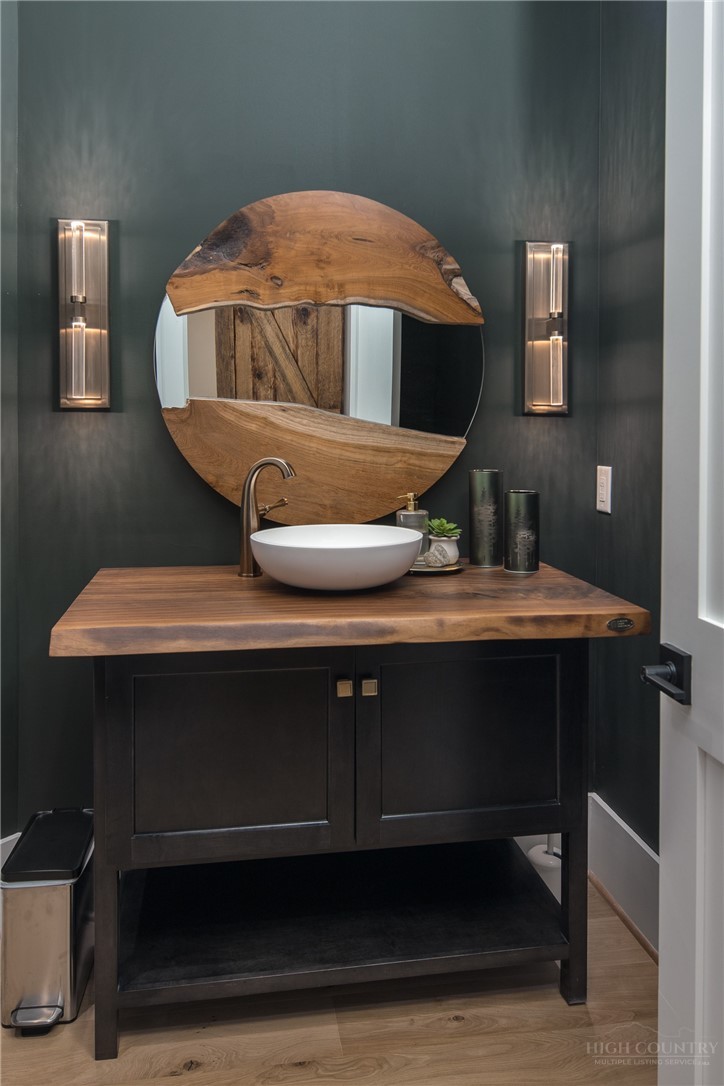 1236 Ninebark Road Boone, NC 28607 - Photo 16 of 50 a bathroom with a sink a mirror and a toilet