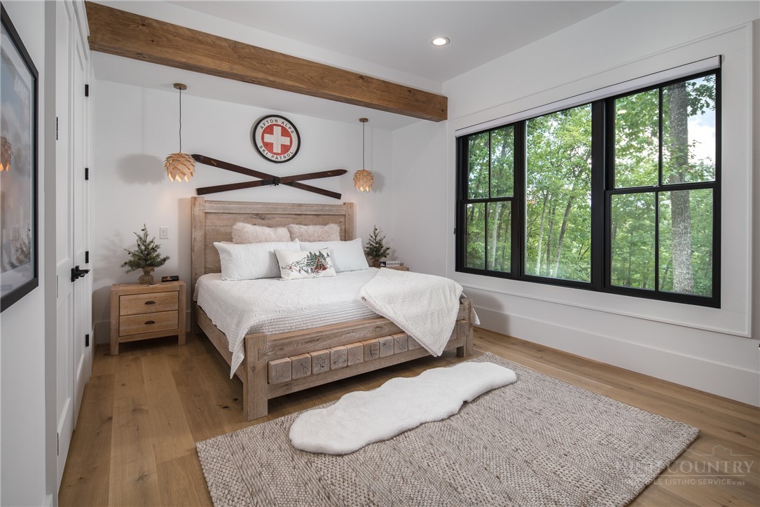 1236 Ninebark Road Boone, NC 28607 - Photo 34 of 50 a bedroom with a large bed and a window