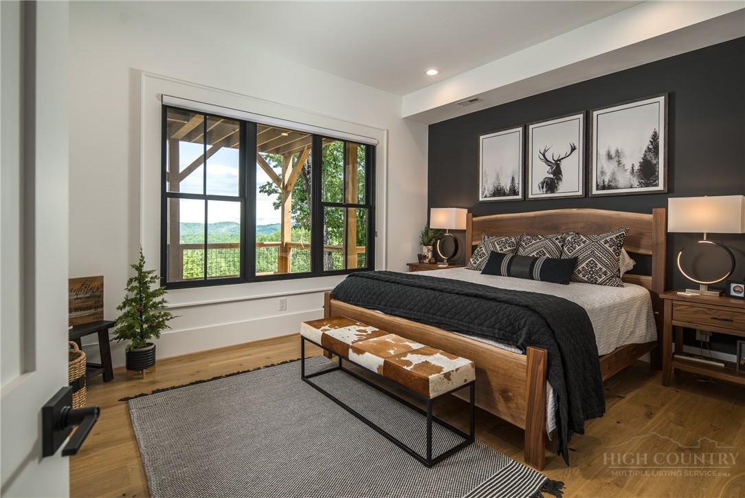 1236 Ninebark Road Boone, NC 28607 - Photo 37 of 50 a spacious bedroom with a bed and a large window