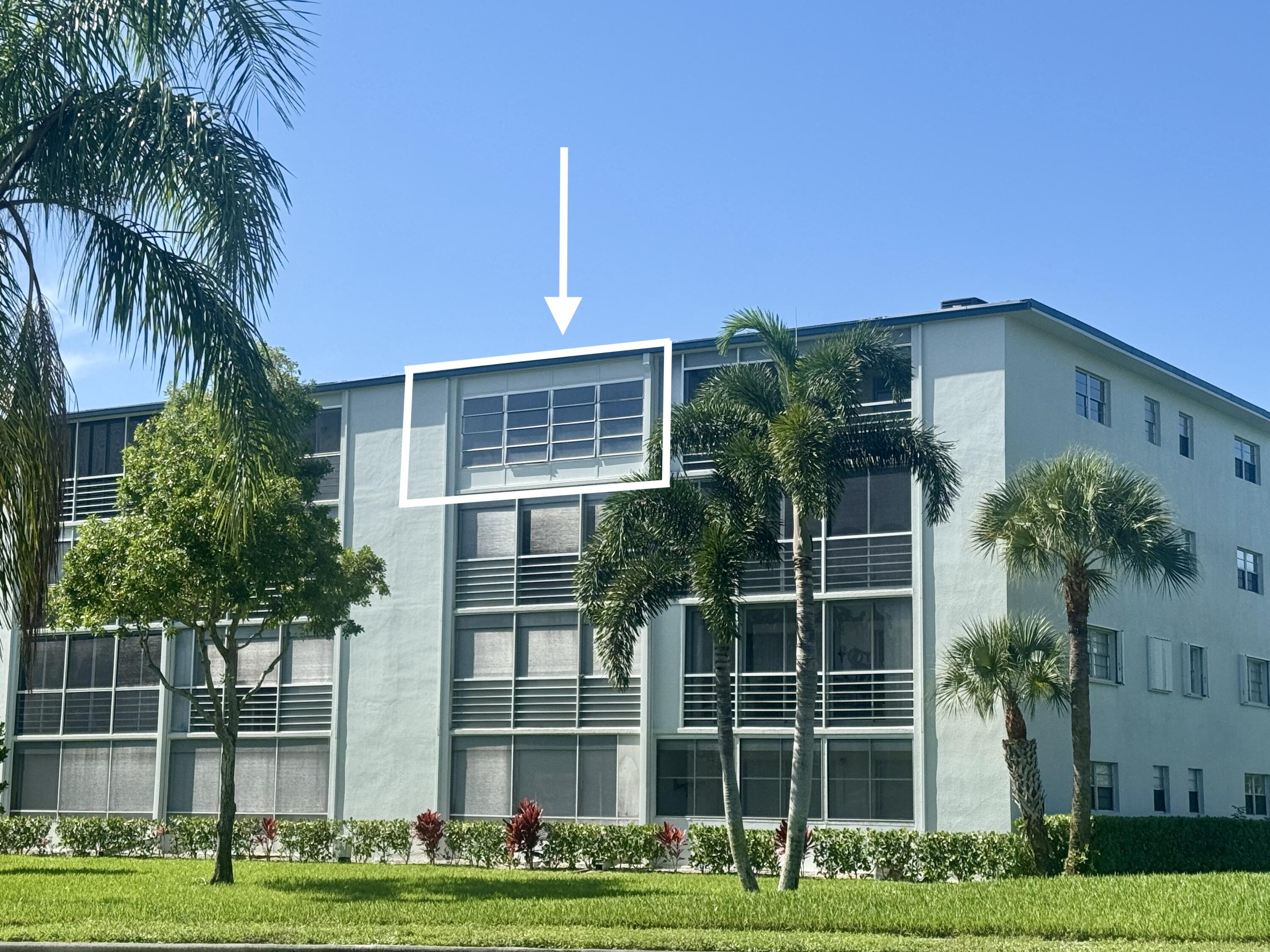 4019 Lincoln A Boca Raton, FL 33434 - Photo 2 of 36 a front view of a house with a garden