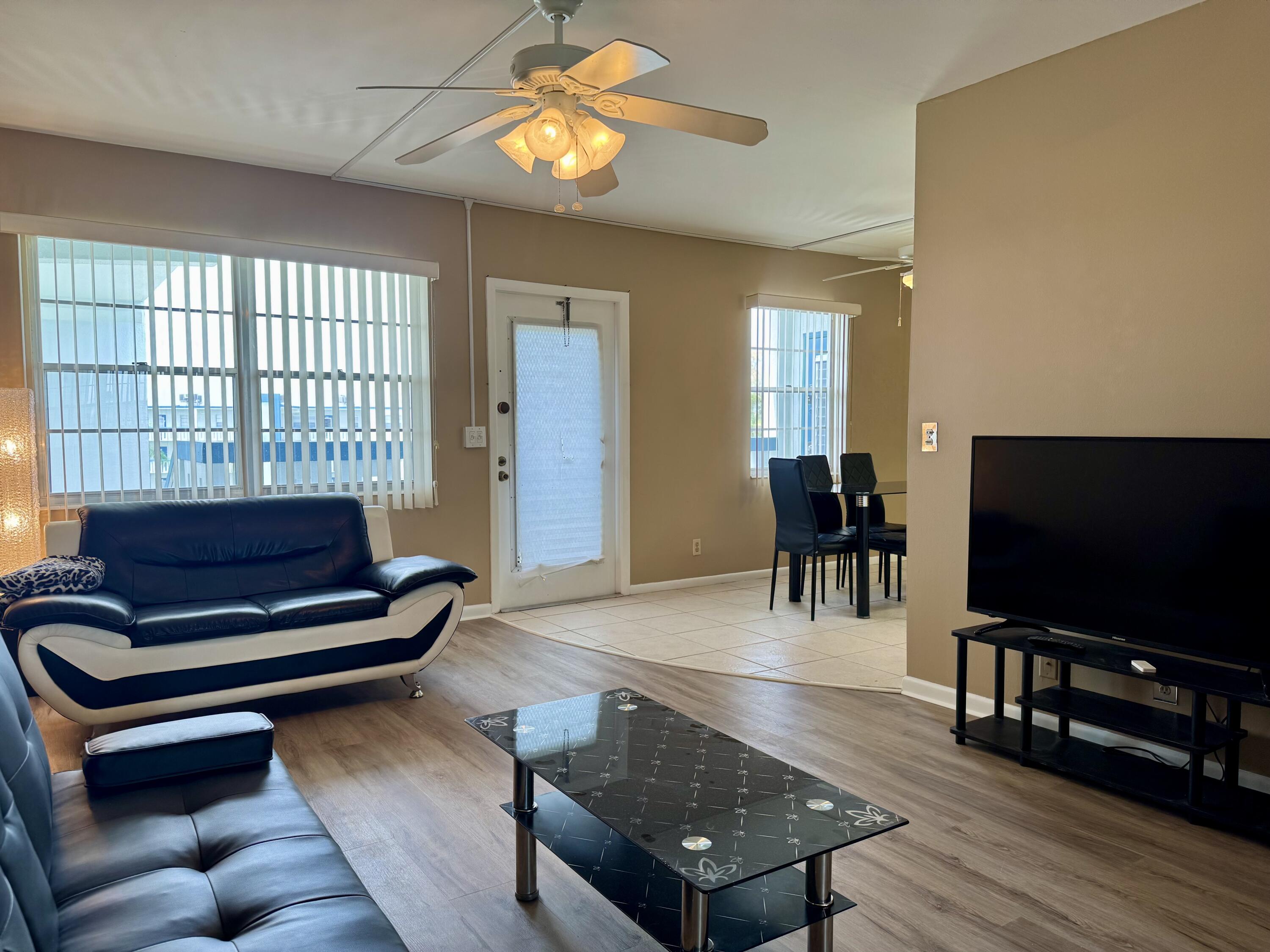 4019 Lincoln A Boca Raton, FL 33434 - Photo 29 of 36 a living room with furniture and a flat screen tv