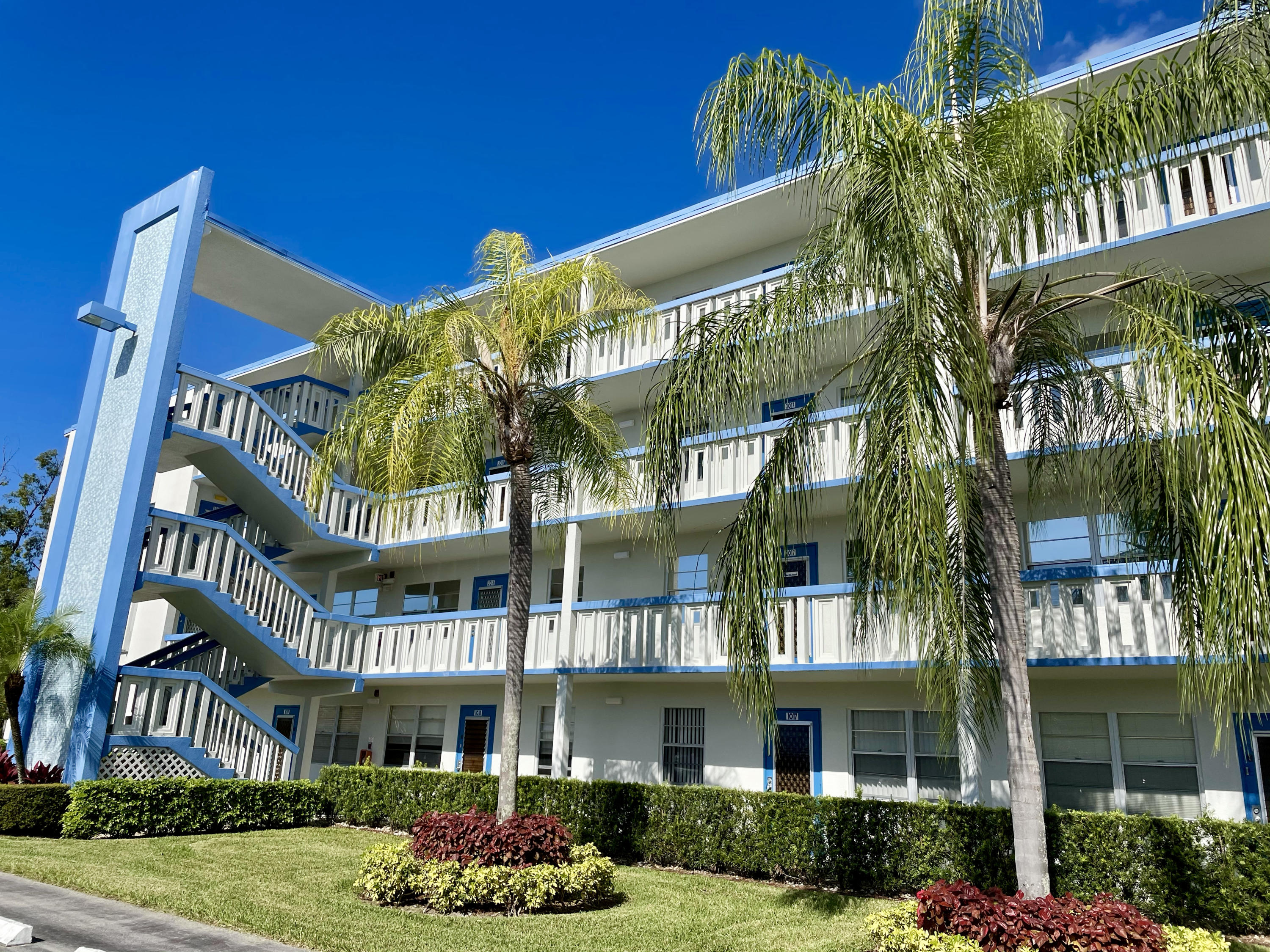 4019 Lincoln A Boca Raton, FL 33434 - Photo 30 of 36 a front view of a multi story building with yard