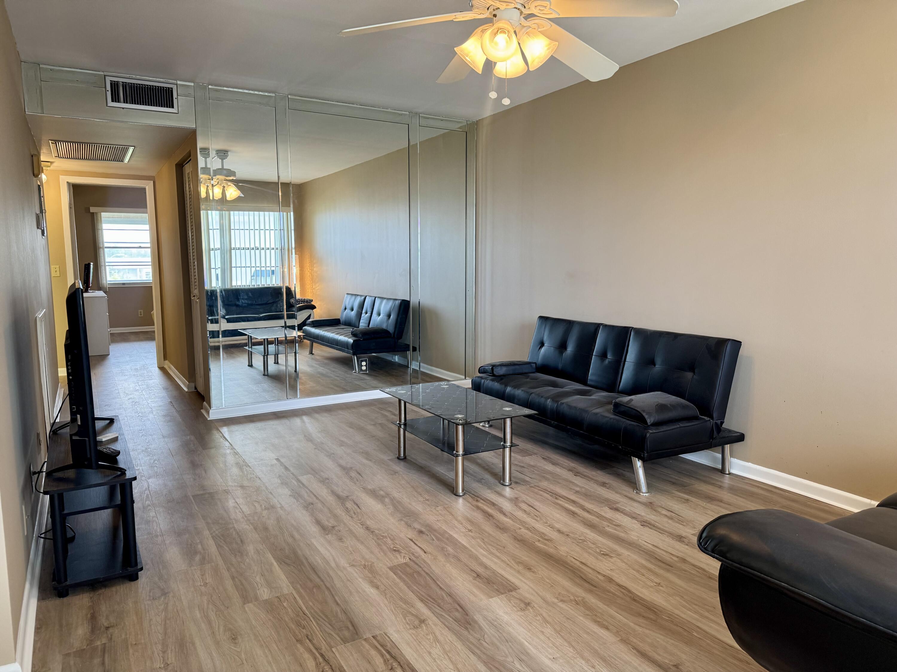 4019 Lincoln A Boca Raton, FL 33434 - Photo 4 of 36 a living room with furniture and wooden floor