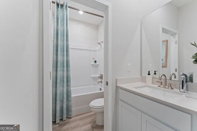 a bedroom with a bed and a table