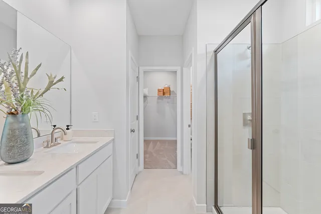 a spacious bedroom with a bed and a couch