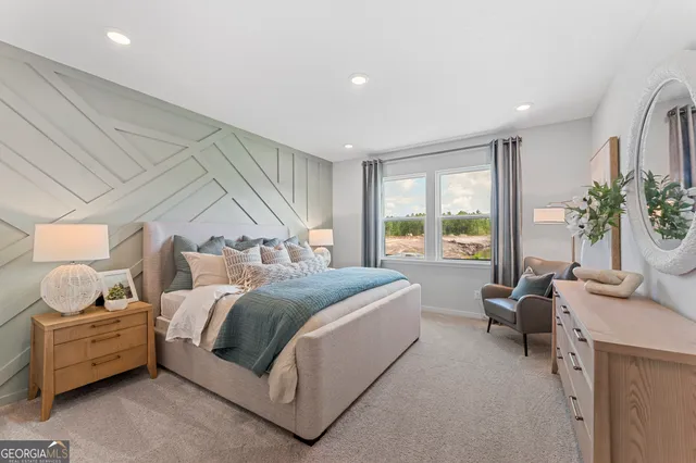 a spacious bedroom with a bed a mirror and a large window with outer view