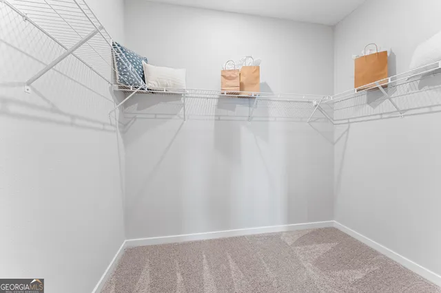 a view of a room with wooden floor and a window