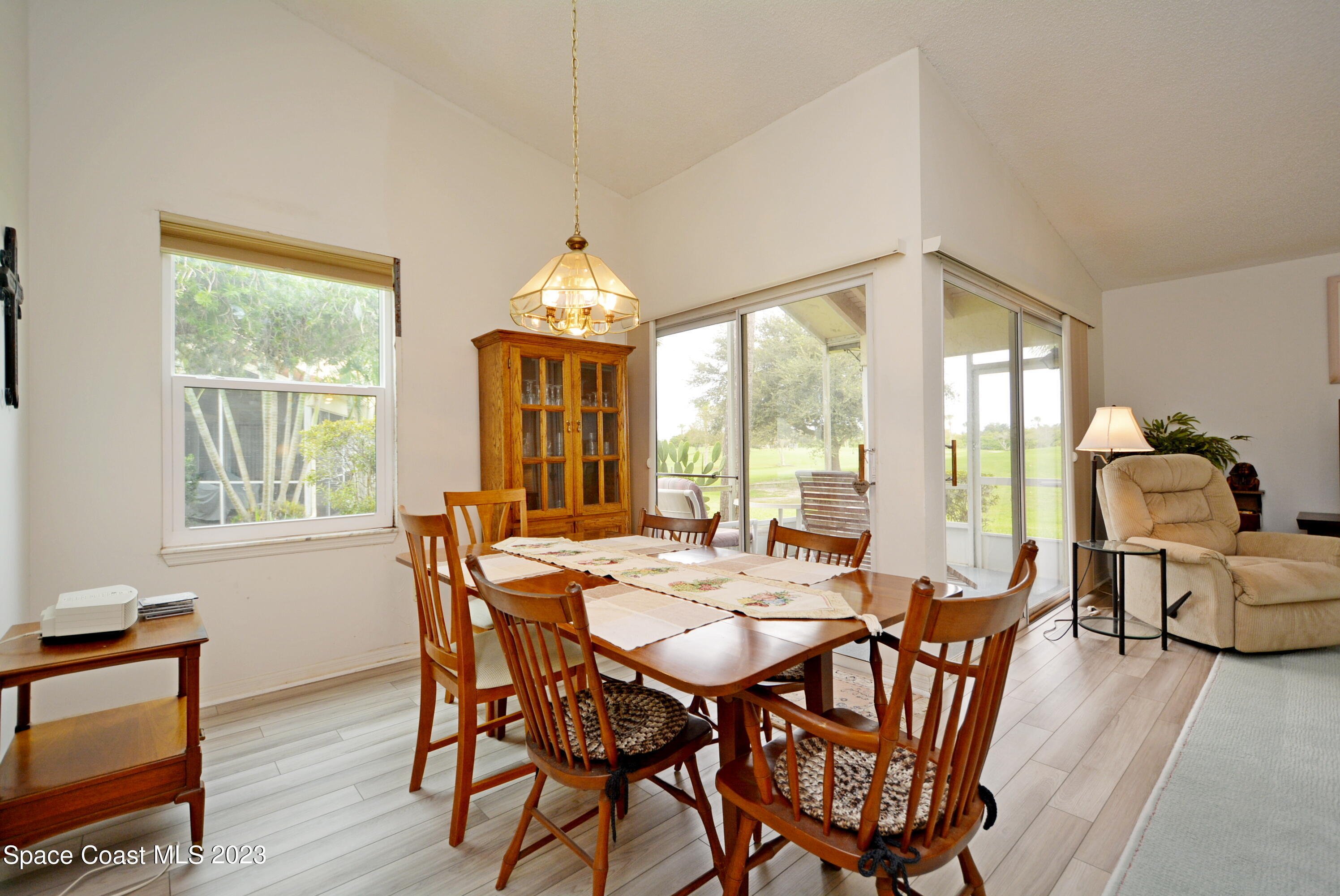 738 Green Valley Lane Melbourne, FL 32940 - Photo 13 of 40 a view of a dining room with furniture window and outside view