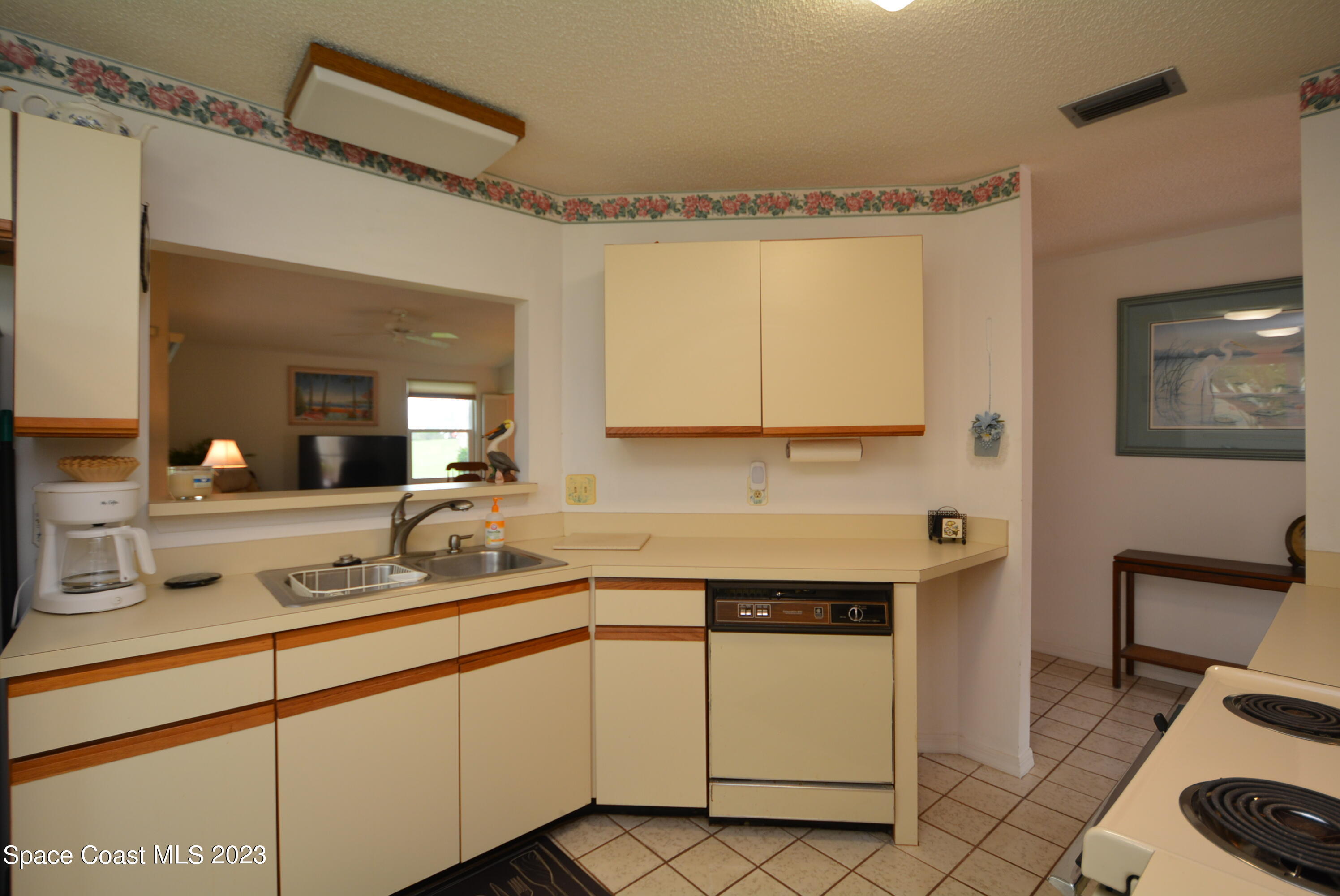 738 Green Valley Lane Melbourne, FL 32940 - Photo 15 of 40 a kitchen with a sink and cabinets