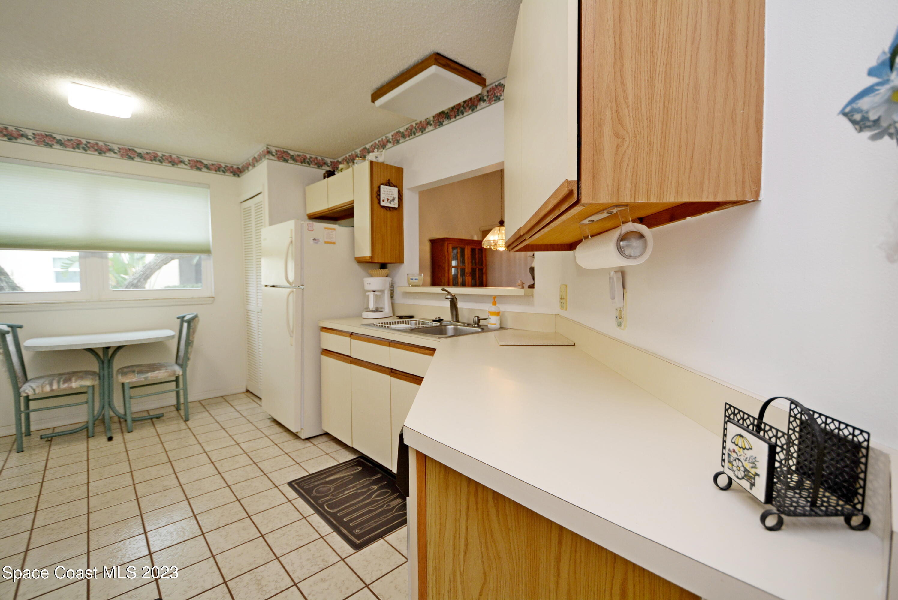 738 Green Valley Lane Melbourne, FL 32940 - Photo 16 of 40 a kitchen with a sink cabinets and window