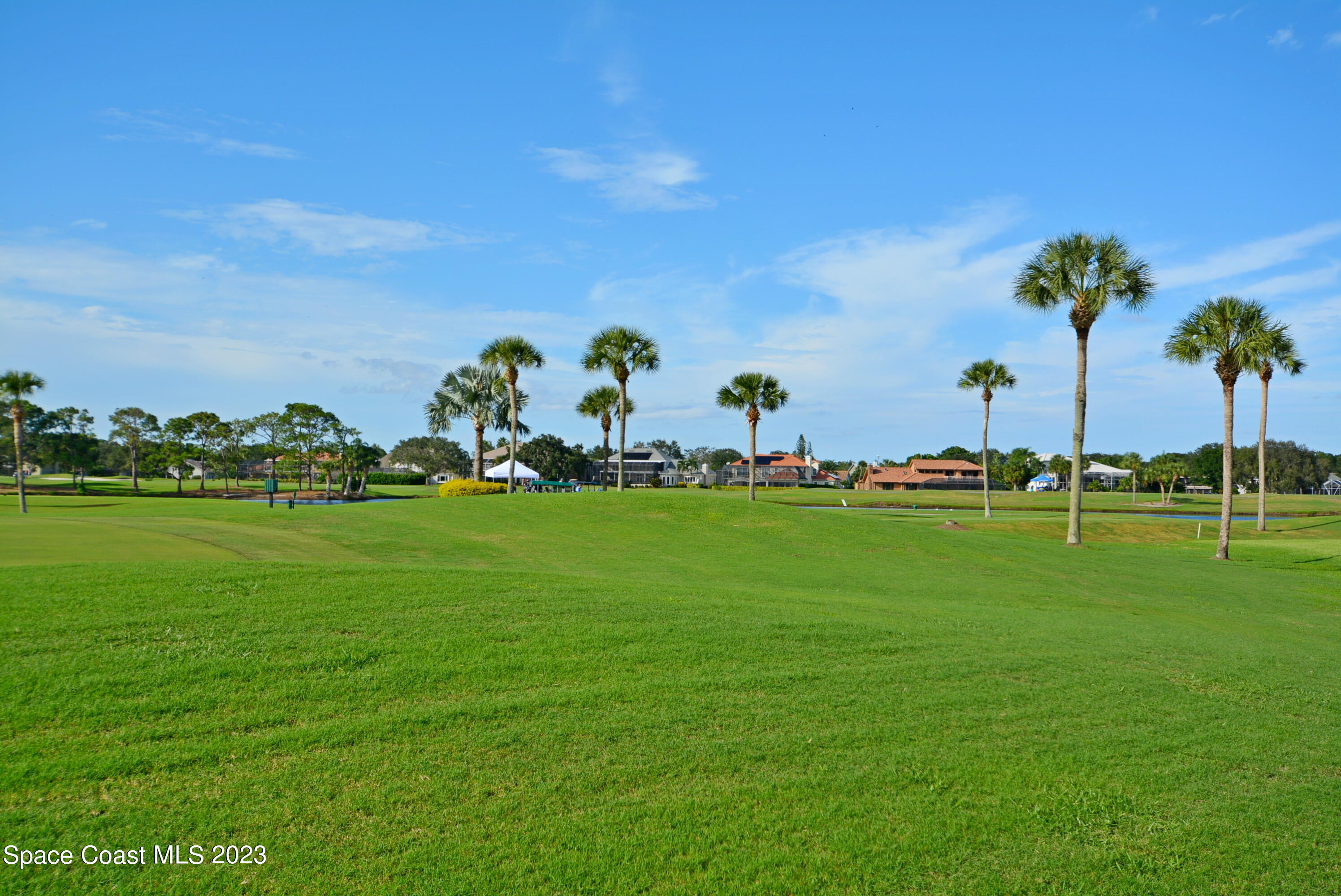 738 Green Valley Lane Melbourne, FL 32940 - Photo 2 of 40 a front view of a house with a garden