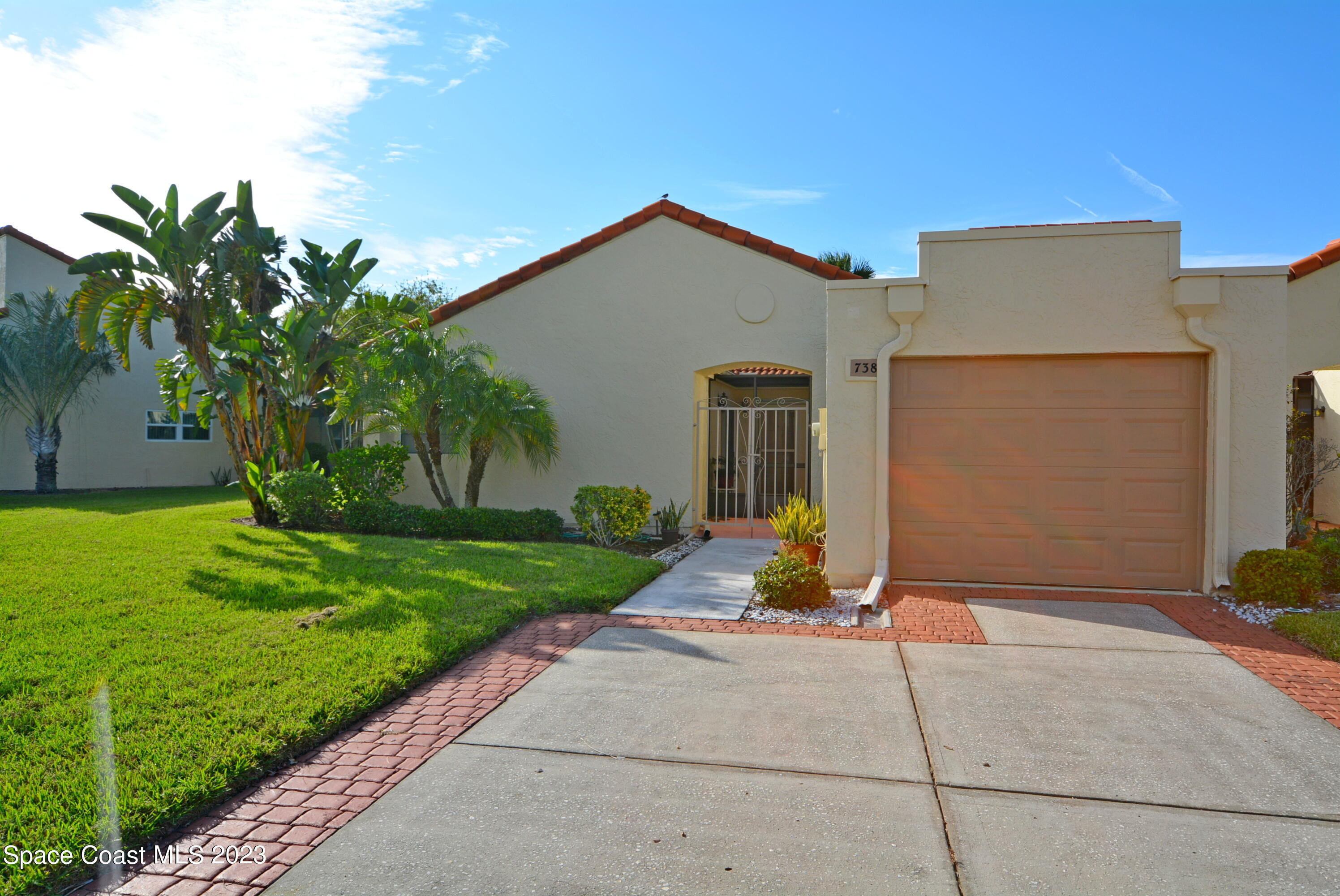 738 Green Valley Lane Melbourne, FL 32940 - Photo 33 of 40 a view of a house with a yard
