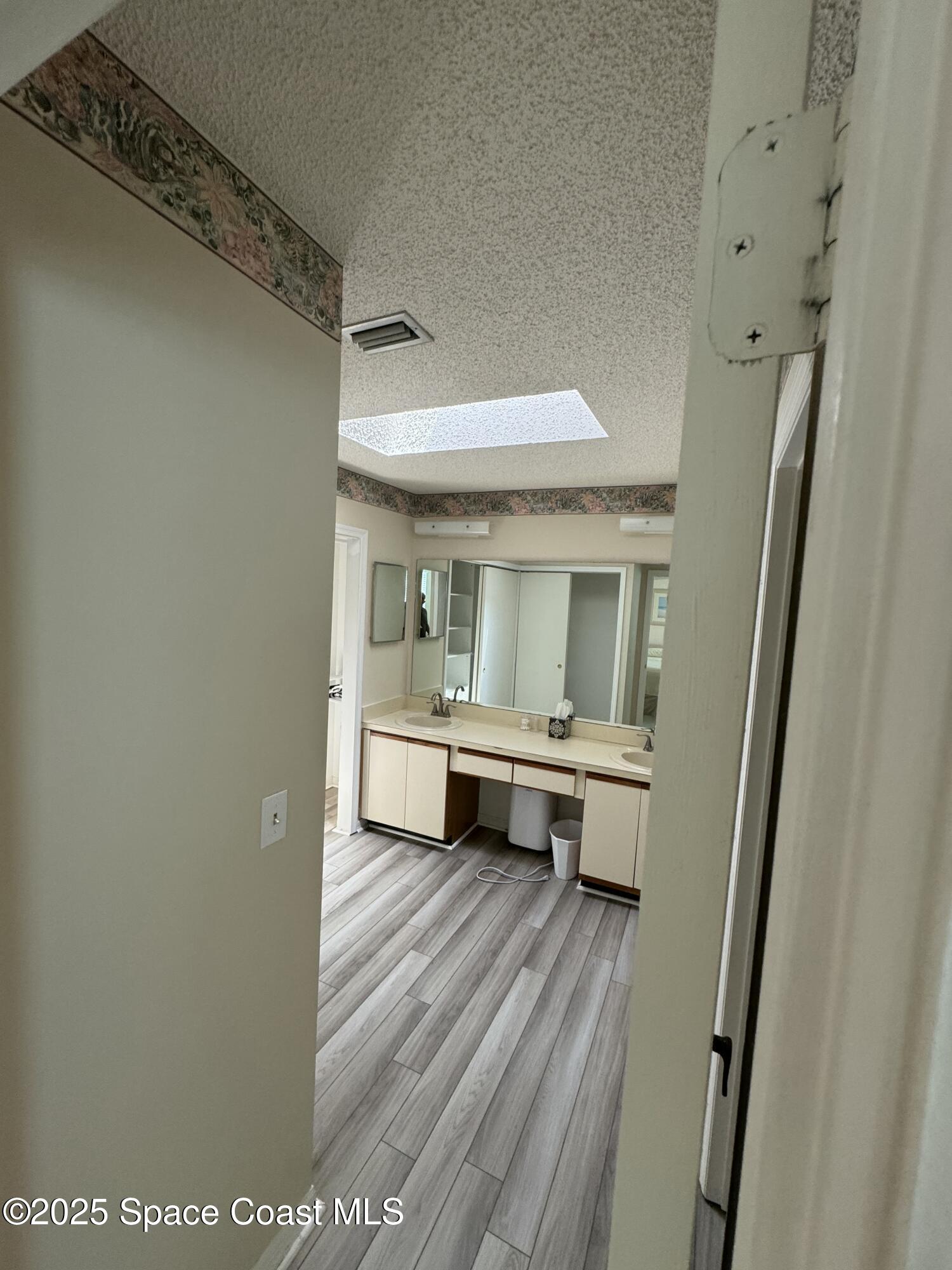 738 Green Valley Lane Melbourne, FL 32940 - Photo 39 of 40 a bathroom with sink and mirror