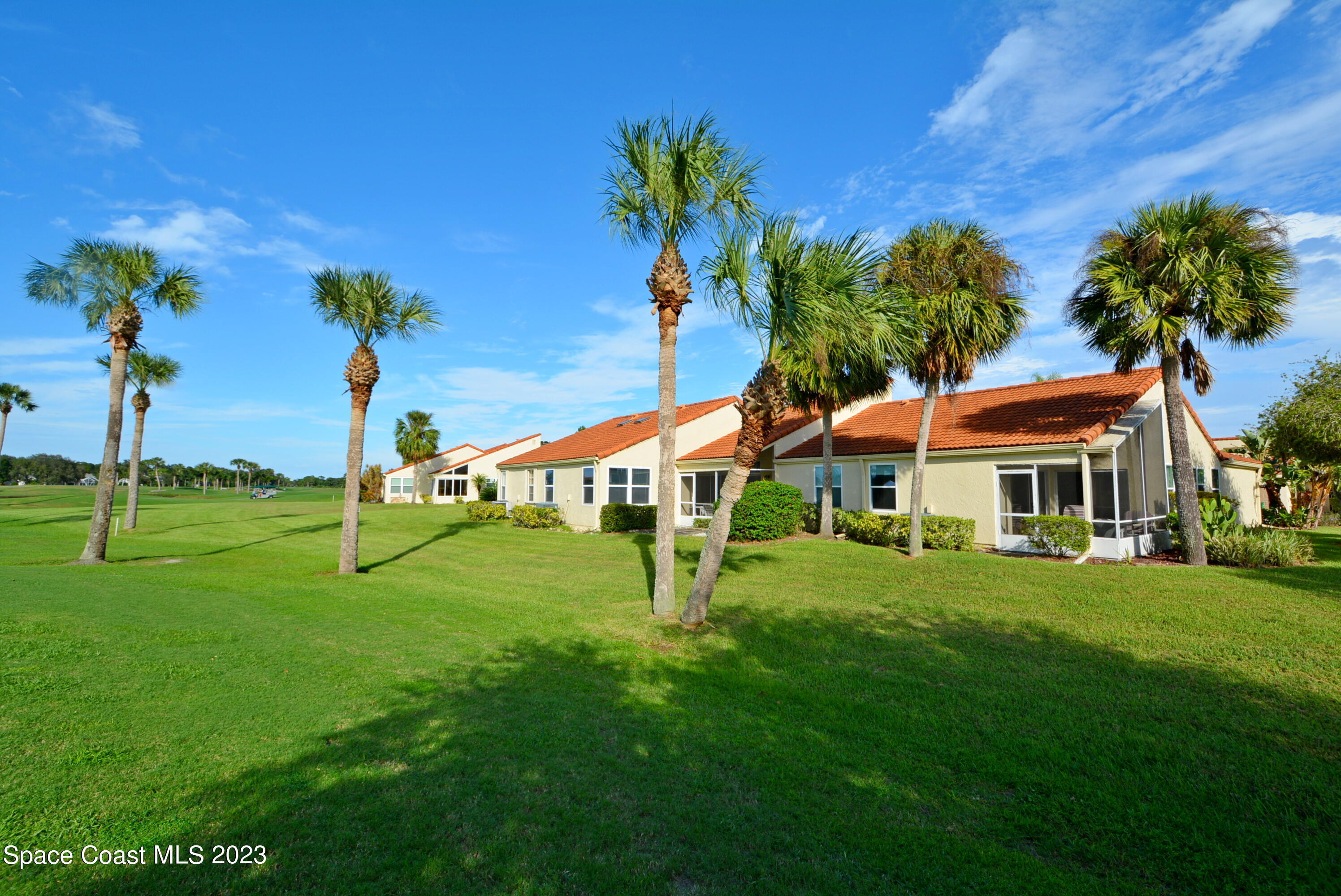 738 Green Valley Lane Melbourne, FL 32940 - Photo 4 of 40 a front view of a house with a yard