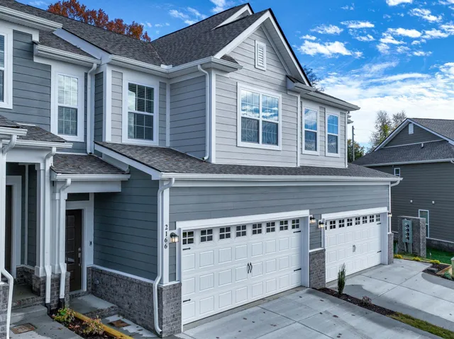 a front view of a house with a garage