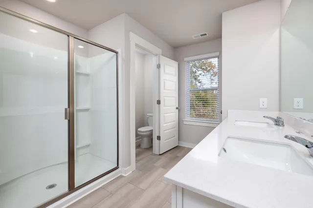 a en suite bathroom with a sink and a shower