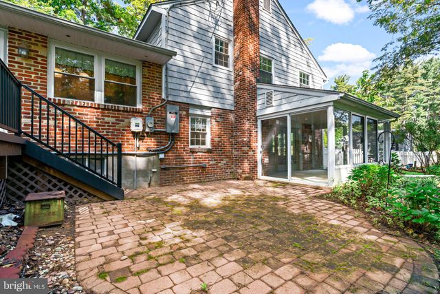 a backyard of a house with wooden floor yard barbeque oven and outdoor seating
