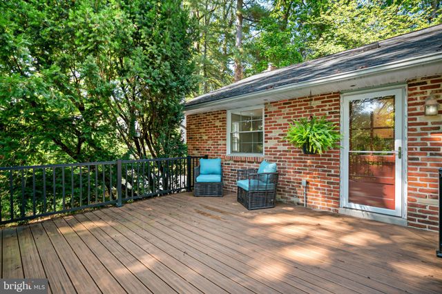a house that has a tree in front of it