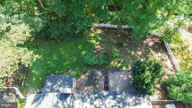 an aerial view of a house with a garden
