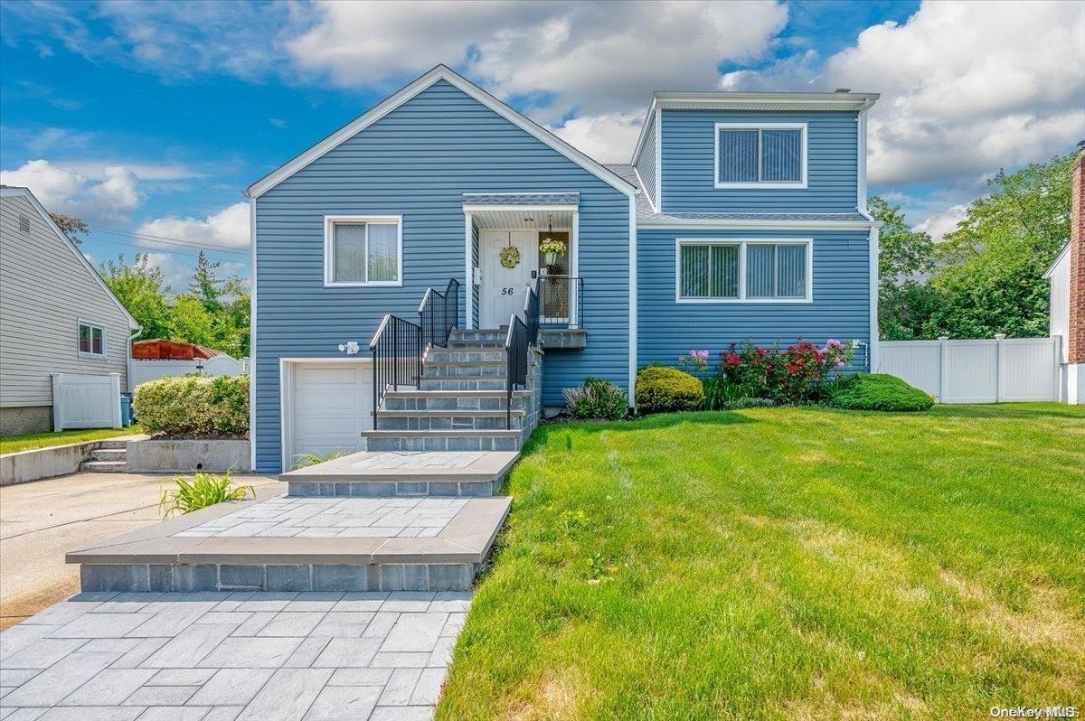 56 Heatherfield Road Valley Stream, NY 11581 - Photo 1 of 1 a front view of house with yard and outdoor seating