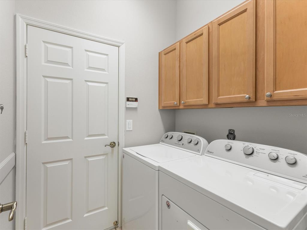 5347 Cappleman Loop Brooksville, FL 34601 - Photo 20 of 28 a utility room with dryer and washer