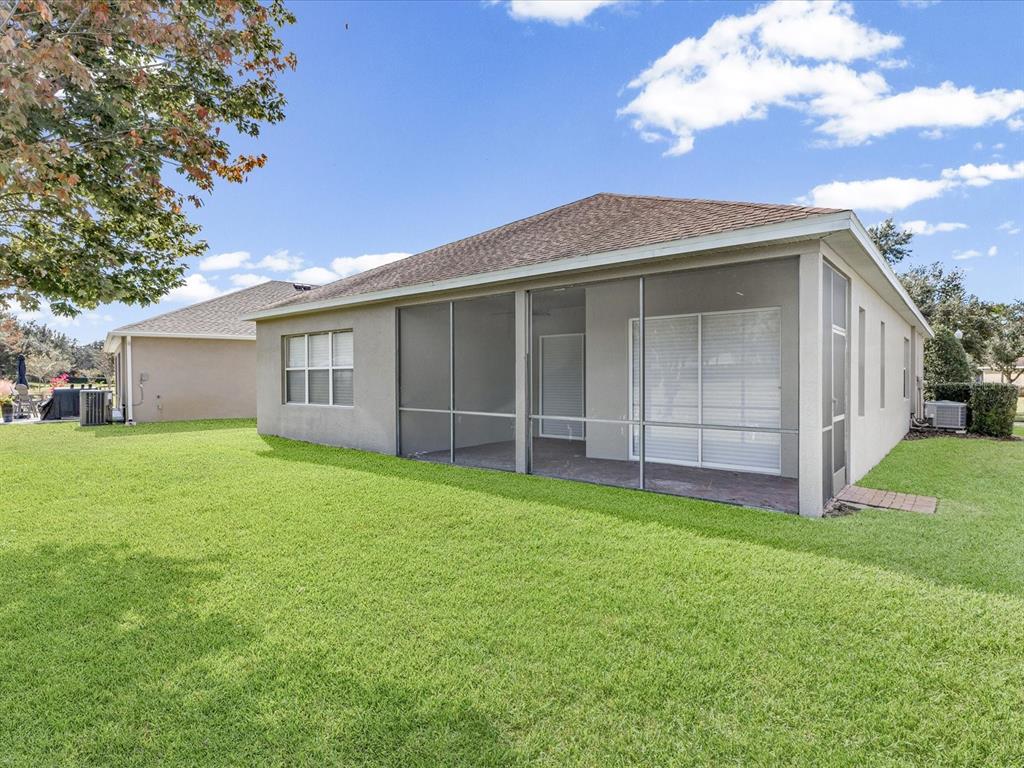 5347 Cappleman Loop Brooksville, FL 34601 - Photo 25 of 28 a view of a house with a yard